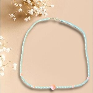 BOHO Faux Pearl necklace with peach accents 17 1/4” long. Central floral bead